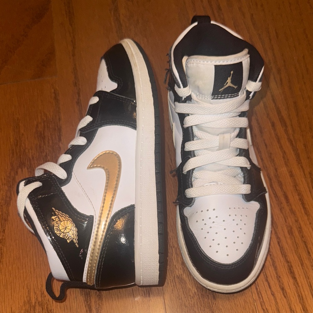 Nike High-Top Sneakers in Black, White, and Gold